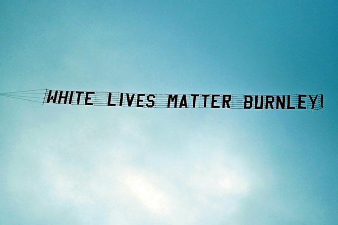 A banner flies above the Etihad Stadium during Monday’s English Premier League match between Manchester City and Burnley. pic/AFP