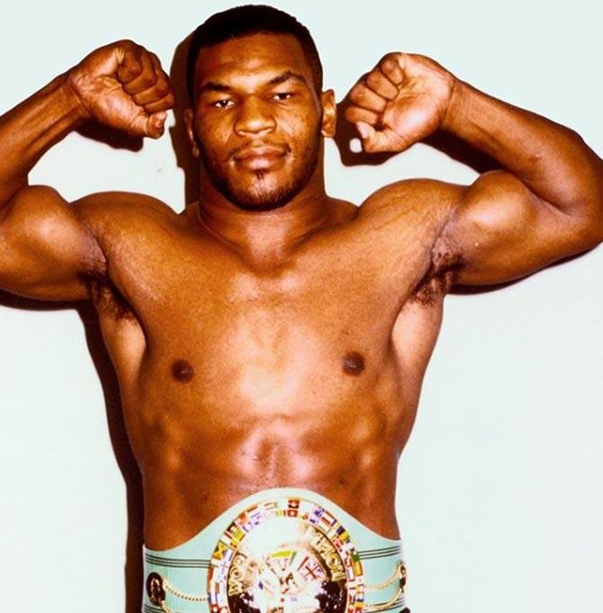 Mike Tyson was the first boxer to simultaneously hold the WBA, WBC and IBF boxing titles and also unify them.