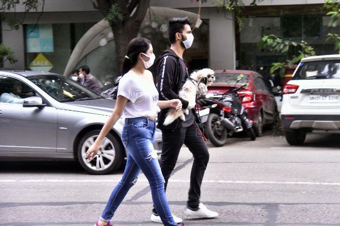 The novel coronavirus continues to spread in India as people use face masks and face shields to protect themselves from the pandemic. In Mumbai, people from all walks of life sporting face masks and face shields were caught on camera by the mid-day photographers