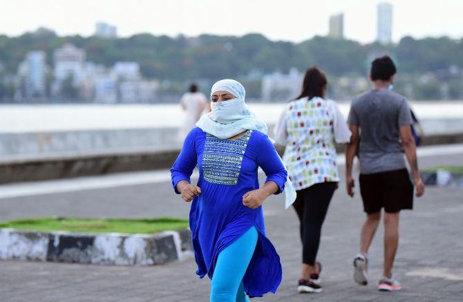 In photo: A woman on an evening walk used her dupatta as a face mask and head gear.