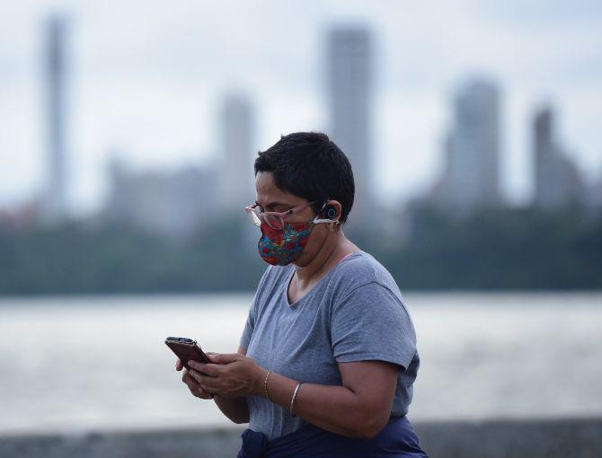 In photo: A woman wearing a trendy face mask with floral designs was captured by mid-day lens man at Marine Drive