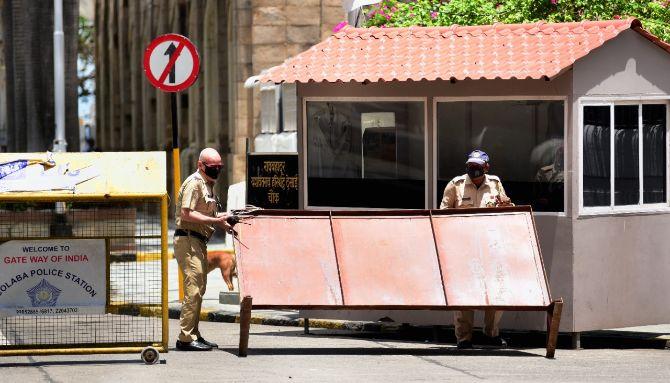 In photo: Police personnel stationed at Hotel Taj Mahal Palace near Gateway of India were seen taking precaution against COVID-19.