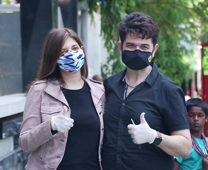 Ace photographer Dabboo Ratnani also happened to be in the same suburb with his wife Manisha Ratnani. The husband-wife duo twinned in their black outfits as they happily posed for the photographers.