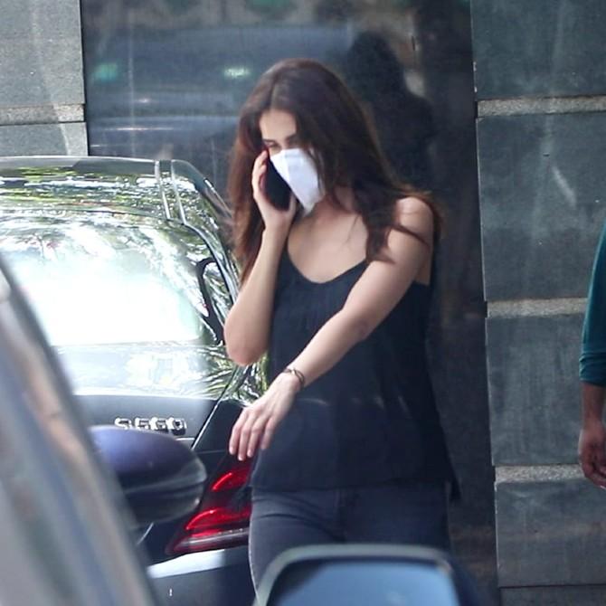 Vaani Kapoor, who was last seen on-screen in 2019-hit film War was snapped at a popularproduction office in the same suburb. She opted for a black crop top and grey trousers. The actress seemed busy on her phone. Wonder who was keeping the Befkire actress busy on the phone?