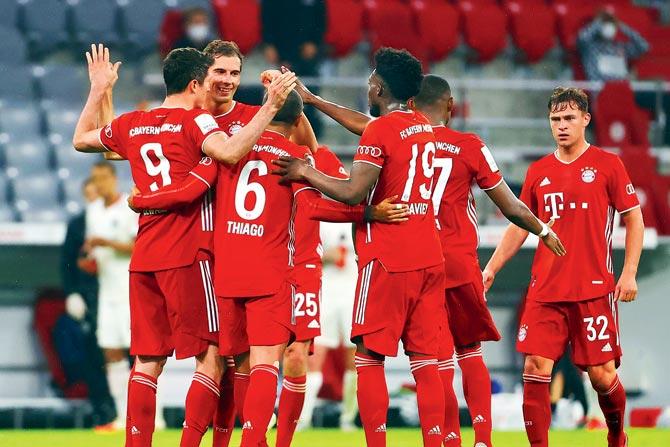 Bayern players celebrate their win over Frankfurt on Wednesday