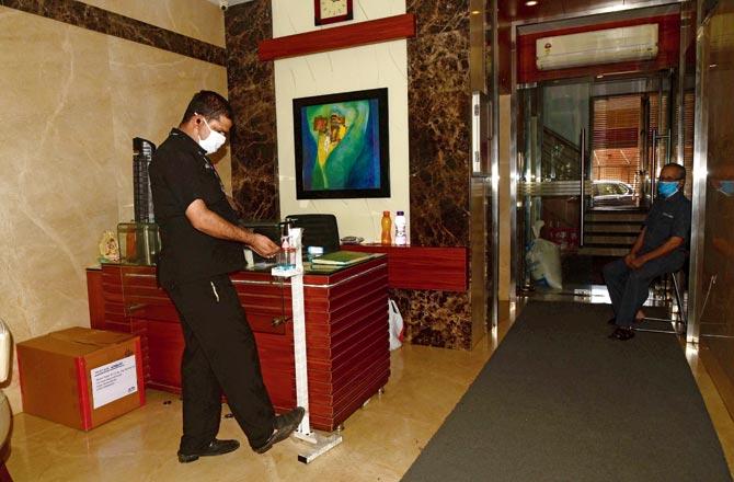 The Mittal Tower management has installed foot-operated hand sanitiser dispenser for those entering the building. Pic/Suresh Karkera