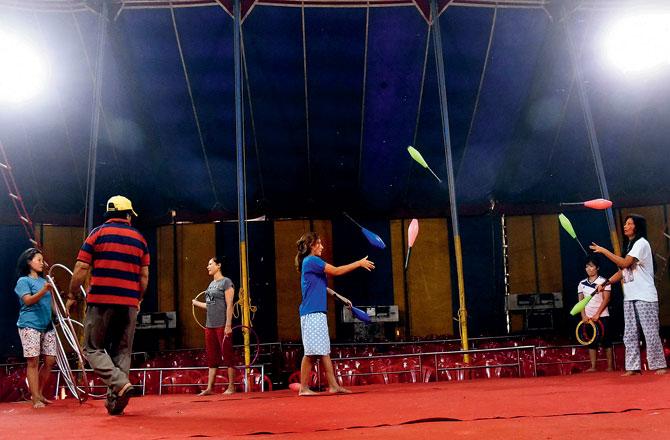 While the city remains closed, performers at the Rambo Circus are killing time by practising indoors in Airoli. Pics/Pradeep Dhivar