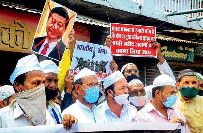 Members of Muslim community stage a protest against Chinese President Xi Jinping in Bhopal, on Sunday. Pic/PTI