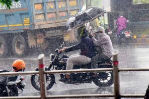 Heavy showers drench city; structures collapse but no casualties