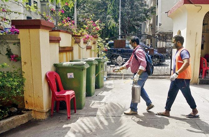 A housing society in Sion being sanitised. File pic/Pradeep Dhivar