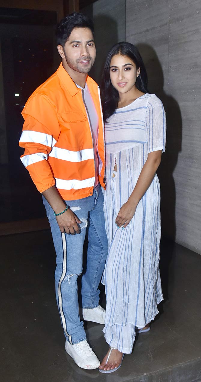 Varun Dhawan and Sara Ali Khan looked tremendously excited as they arrived for the wrap-up party of their upcoming film, Coolie No. 1. All pictures courtesy: Yogen Shah