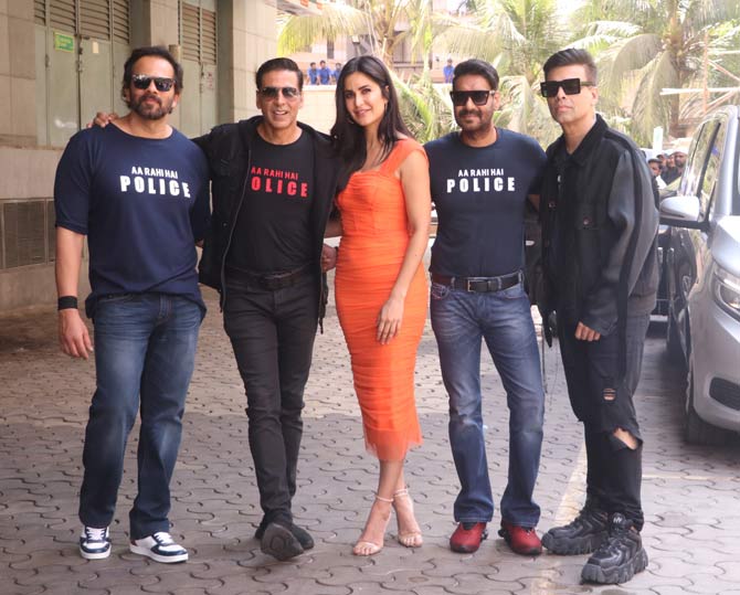 Akshay Kumar along with Katrina Kaif and other cast and crew launched the trailer of Rohit Shetty's cop franchise's next outing Sooryavanshi at a popular multiplex in Juhu. While Katrina looked pretty in her orange body-hugging dress, the guys wore 'Aa Rahi Hai Police' tee with denim as they arrived for the trailer launch. All pictures/Yogen Shah