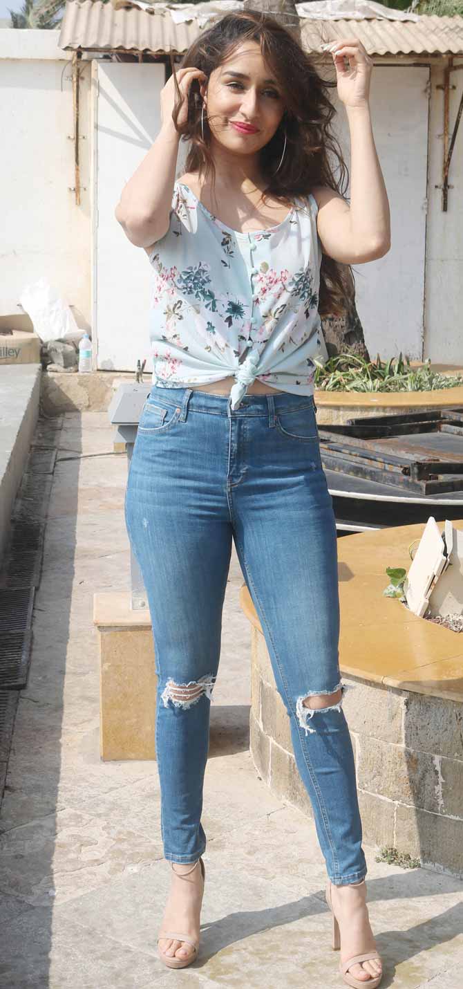 Shraddha Kapoor wore a lovely white top and accompanied it with ripped blue jeans and made a ravishing appearance for the promotions of Baaghi 3. As the wind blew her hair away, she posed candidly for the paparazzi.