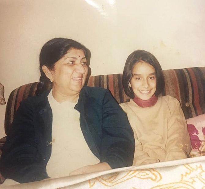 Little Shraddha Kapoor poses with legendary singer Lata Mangeshkar, who is her grandmother. Lata Mangeshkar's first cousin, Pandit Pandharinath Kolhapure is Shraddha's maternal grandfather.