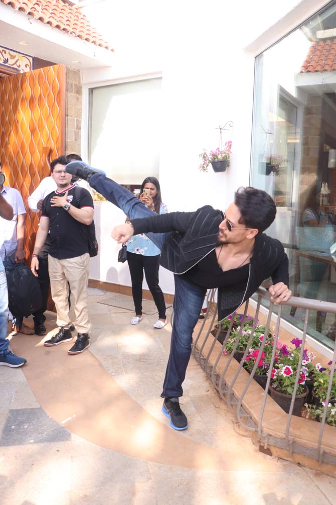 Tiger Shroff was clicked celebrating his 30th birthday at the promotions of Baaghi 3. The actor, who was all elated about his upcoming film, also had a cake cutting ceremony in front of the media. All pictures/Yogen Shah