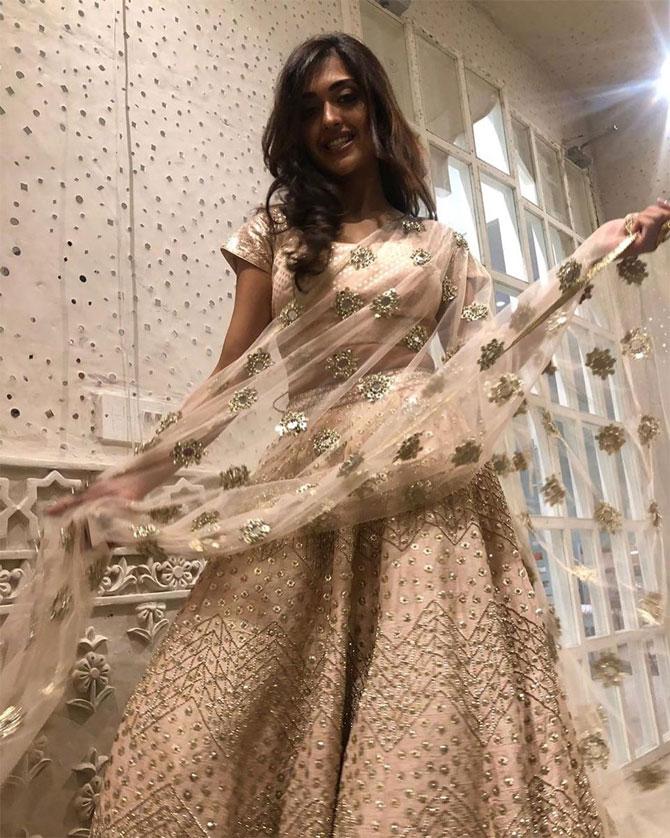 Bharadwaj shines in this ivory lehenga with floral motifs embroidered on her dupatta.