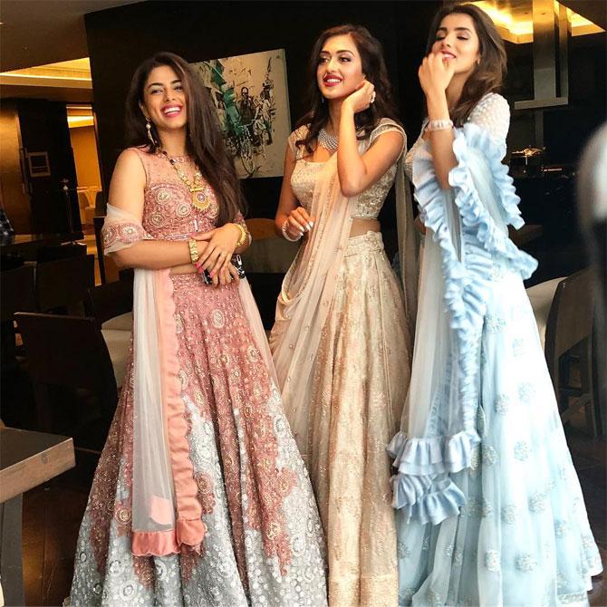 She stands out from the rest in this off-white lehenga worn with a statement neckpiece and a bangle.

