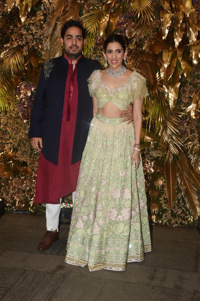 For the after-wedding party, Akash and Shloka complemented each other in ethnic ensembles. While Shloka Mehta looked elegant in a cream and green lehenga, Akash looked like one of the best man in a kurta pajama in hues of maroon and white.