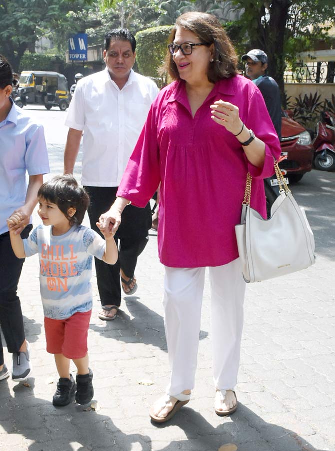 Taimur Ali Khan was snapped wearing a baby striped t-shirt, paired with red baby shorts and black sports shoes. Doesn't he look adorable?