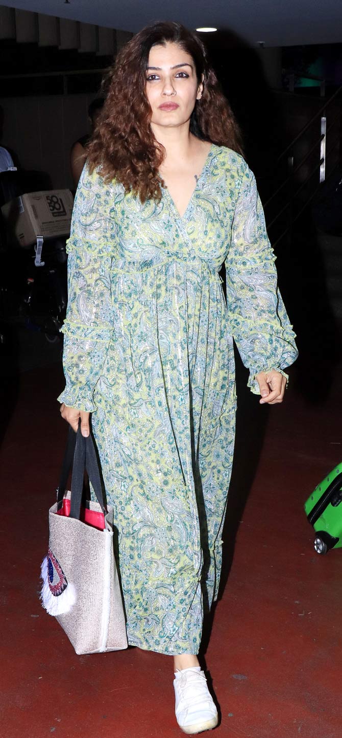 Raveena Tandon flaunted her curly tresses when snapped at the Mumbai airport. 
