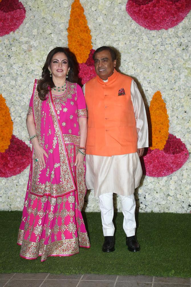 Mukesh and Nita's swashbuckling lifestyle is envied by many. In October 2019, the Ambanis celebrated their first Diwali after the weddings of Akash Ambani with Shloka Mehta, and Isha Ambani with Anand Piramal. For the Diwali bash, Nita Ambani looked stunning in an elaborate blouse and pink lehenga which she paired with a diamond and emerald neckpiece. Meanwhile, Mukesh sported a golden kurta and completed his look with an orange jacket.


