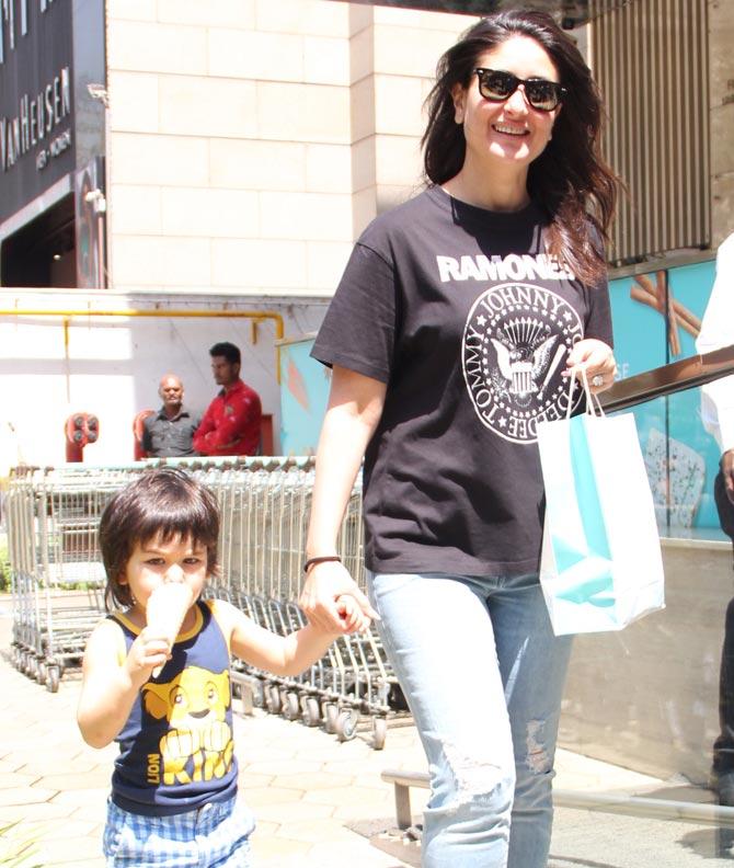 Kareena Kapoor Khan is all smiles for the media like she always is and Taimur Ali Khan still continues to grab his ice-cream.