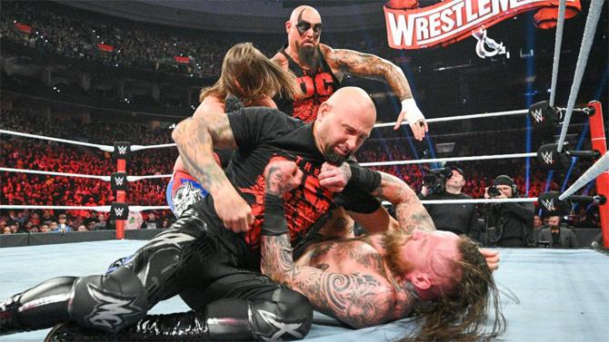 However, to no surprise, The O.C. interrupted the match and began attacking Aleister Black