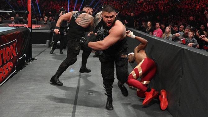 AOP - Seth Rollins' followers - interrupted the match attacking the Street Profits.
