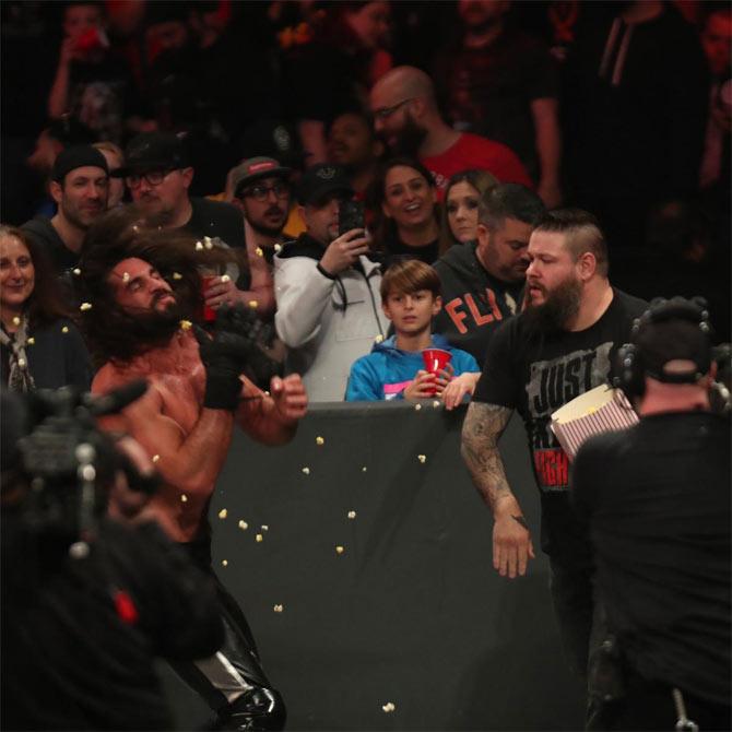 Kevin Ownes appeared from the crowd munching on popcorn and distracted Seth Rollins