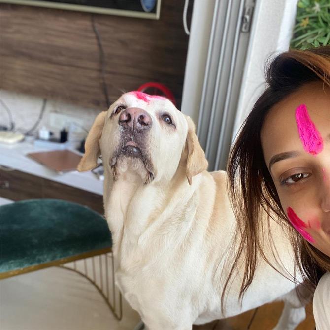 With organic colours smeared on her forehead and cheeks, Mimi celebrated the festival with her pet dogs as well. 
















