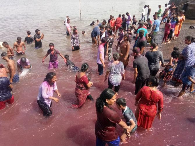 Holi, which is celebrated to welcome the spring season, was also taken to the seashore at Worli by residents. 