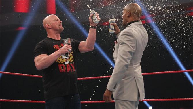 Stone Cold Steve Austin's return had Byron Saxton receiving some education on 316 Day. he rated Steve Austin's laws and was called to the ring