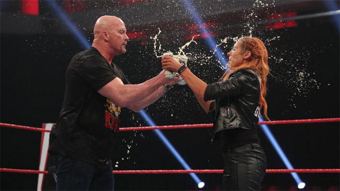 WWE Raw Women's champion Becky Lynch then made her way to the ring and enjoyed some beer drinking with Stone Cold Steve Austin in the ring.