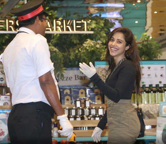 Nushrat Bharucha dressed in a black tee and olive pants was clicked arriving at a famous food mall in Bandra. The Sonu Ke Titu Ki Sweety actress was also spotted wearing gloves for her protection.