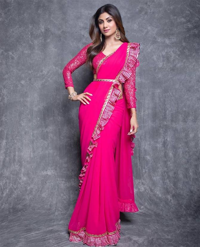 Shilpa Shetty is often seen sharing some pretty pictures posing in six-yard! Let's take a look at her wardrobe on social media. Draped a pretty pink saree, Shilpa wrote, 