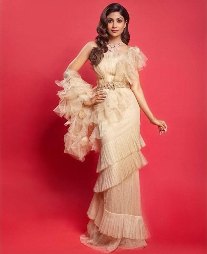 Ruffles are back in fashion, and we can't get enough of it! This beige coloured ruffled saree with a dash of sparkles will make you invest in something like this instantly! What do you think?