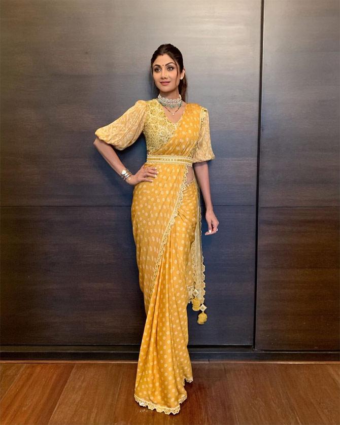 During Ganesh Chaturthi 2020, Shilpa Shetty Kundra opted for a polka dot saree, but did you know what is the winner in this one? Her bell-sleeved blouse and a belt! Doesn't she look like an epitome of fashion?