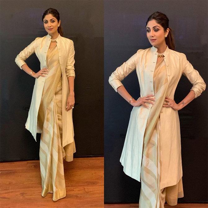 Shilpa Shetty's organza pick with a trench coat makes it a perfect cocktail saree. What do you think?
