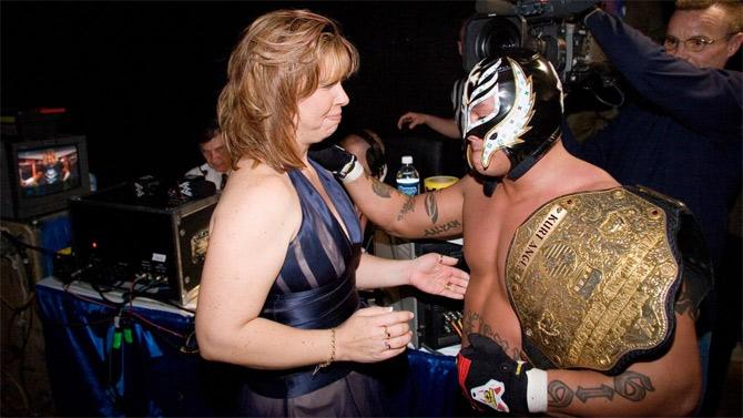 Eddie Guerrero's wife Vickie Guerrero along with his closes friend Rey Mysterio backstage.