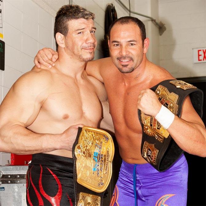 The late Eddie Guerrero poses with his nephew Chavo Guerrero backstage. Eddie won the WWE title once. He passed away in November 2005 at age 38.