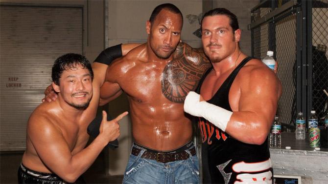 WWE superstar Dwayne 'The Rock' Johnson along with fellow wrestlers Rhyno and Tajiri.