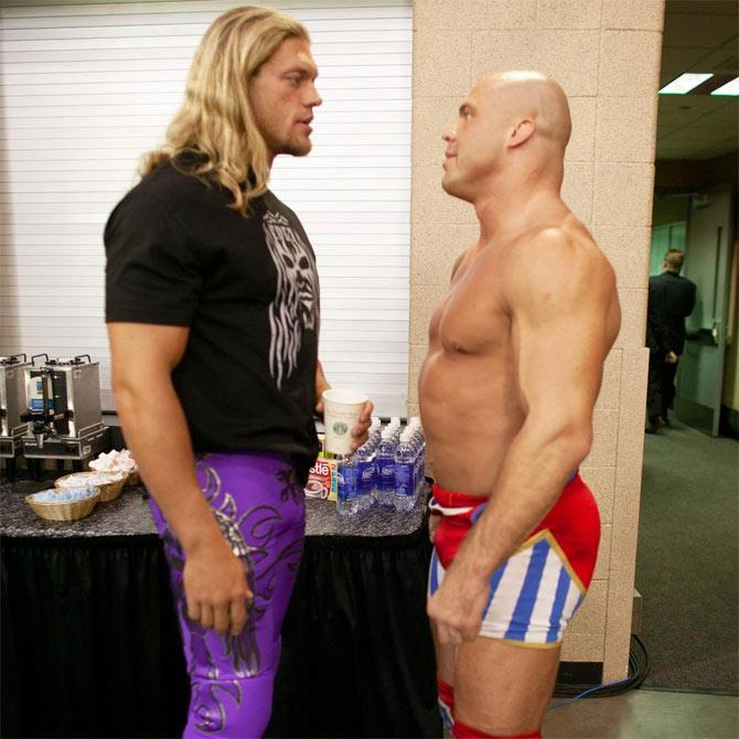 WWE superstars Edge and Kurt Angle have a staredown backstage. Both wrestlers have been vital during Attitude Era and Ruthless Aggression Era.