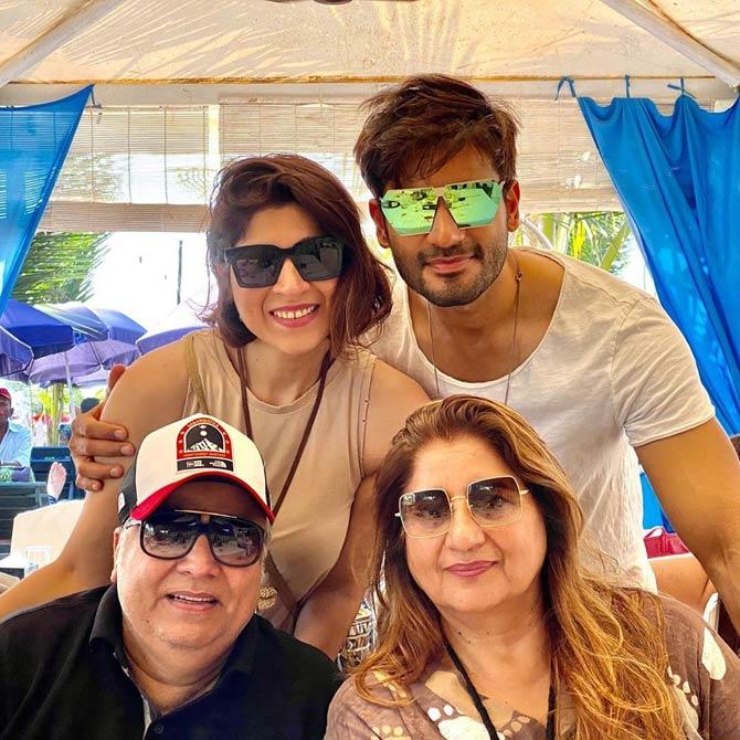 Born into a Punjabi family, Karan Tacker acquired a degree in business management before he decided to foray into the television industry. 
Pictured: Karan with his mum, dad and sister Sasha