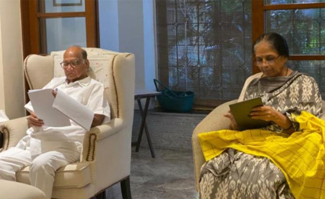 In photo: Sharad Pawar and his wife Pratibha Pawar read books as they maintain social distance at home while being quarantined.