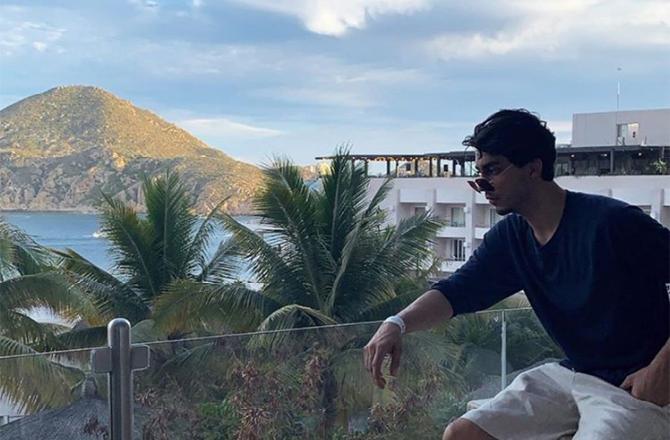 Aryan Khan: A fan club of Aryan on Instagram uploaded a picture of him all the way from Mexico where he could be seen chilling alone and posing for the camera. What caught our attention was the goatee that he was sporting.