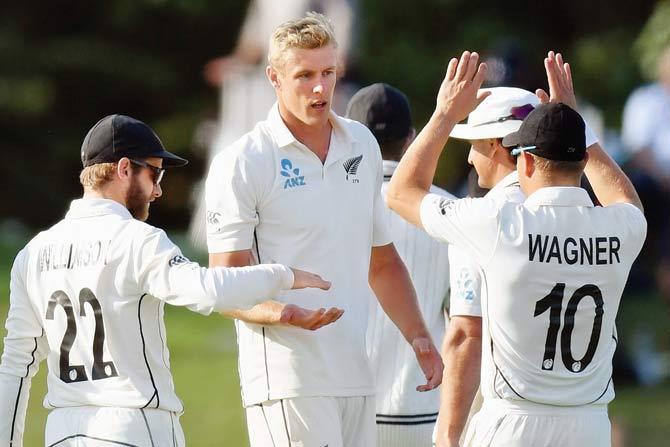 NZ pacer Kyle Jamieson (centre) celebrates an Indian wicket on Saturday