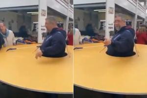 Viral video shows Italian man wearing large disc to fight COVID-19