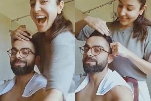 Anushka Sharma chops Virat Kohli's hair and he's not complaining!