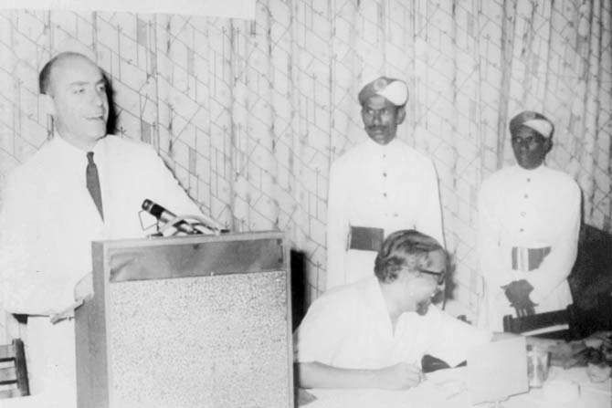 An undated picture shows Alan Berg delivering a talk in India