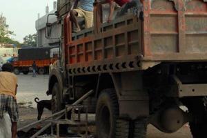 Garbage collecting vehicle used to transport migrant labourers in Bihar